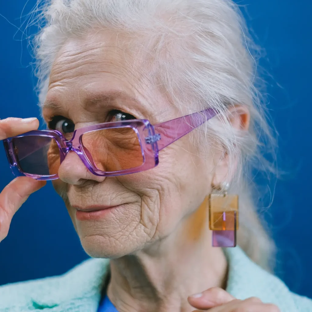 old lady happy with ear plugs and ear wax removal